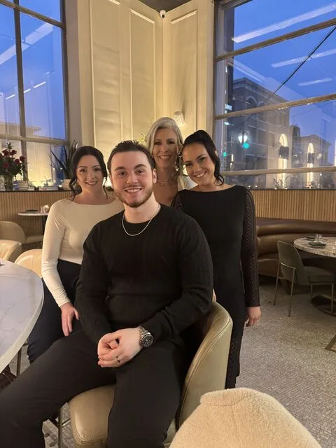Jamie with a group at dinner